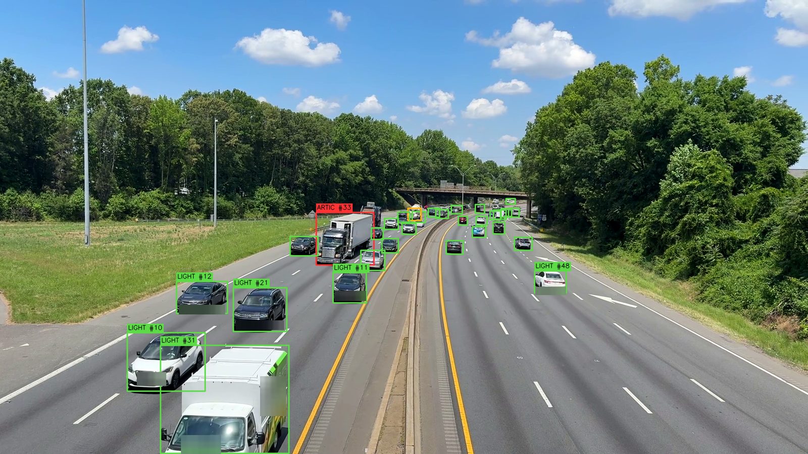 Freeway traffic with light, medium and articulated vehicles marked according to vehicle class