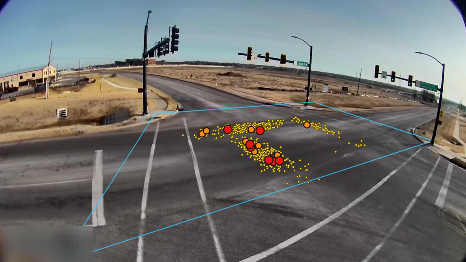Camera view of an intersection with every measured crossing point drawn as a dot inside the intersection box